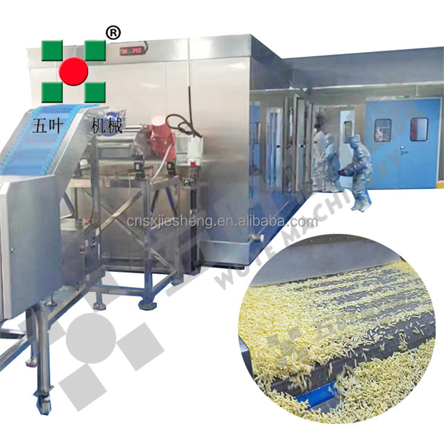 Industrial freezing equipment interior showing conveyor belt and stainless steel construction